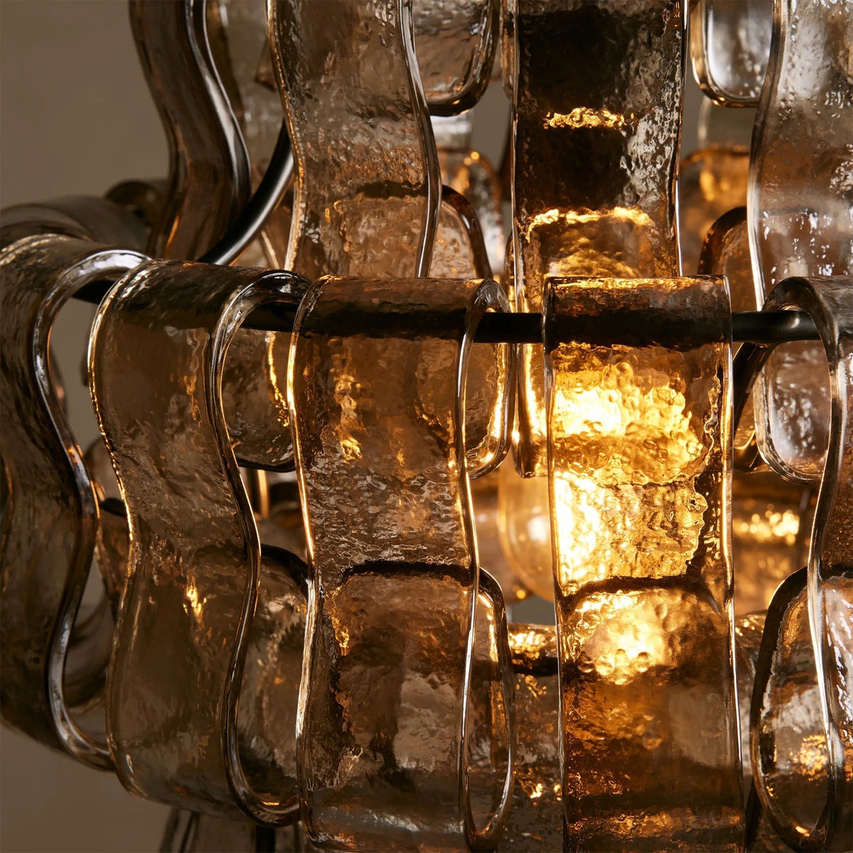 The Amber version of the Nirsa Pendant Light suspended over a dining table.