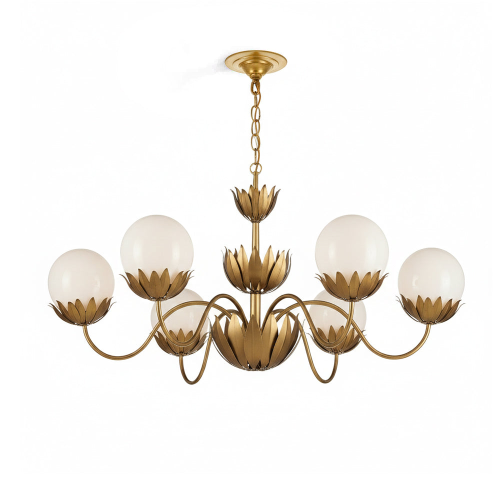 Noemie Chandelier with six arms in a brass finish against a plain background.