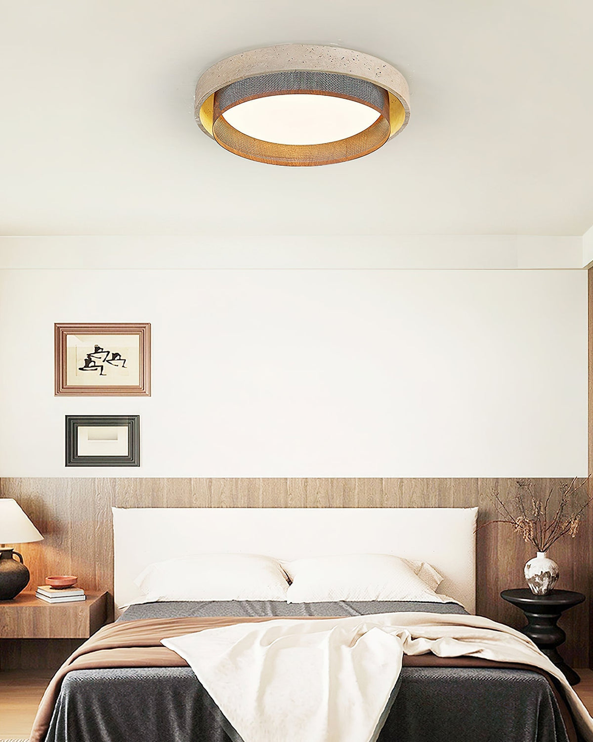 Side profile of the round Nolan ceiling light against a neutral wall.