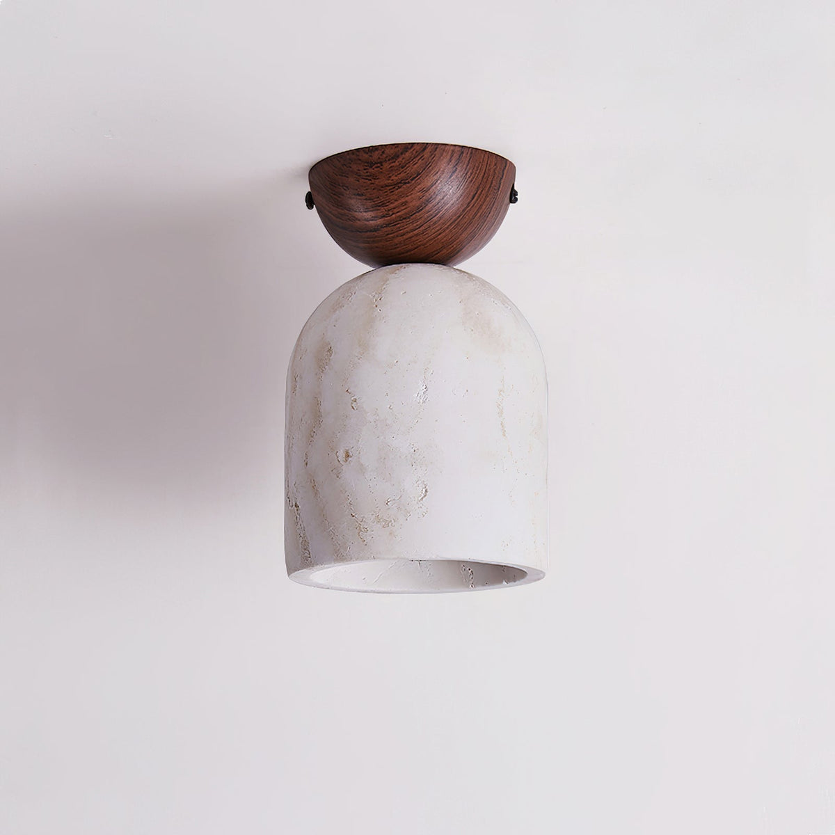 Detail shot of the connection between the wood mount and travertine body.