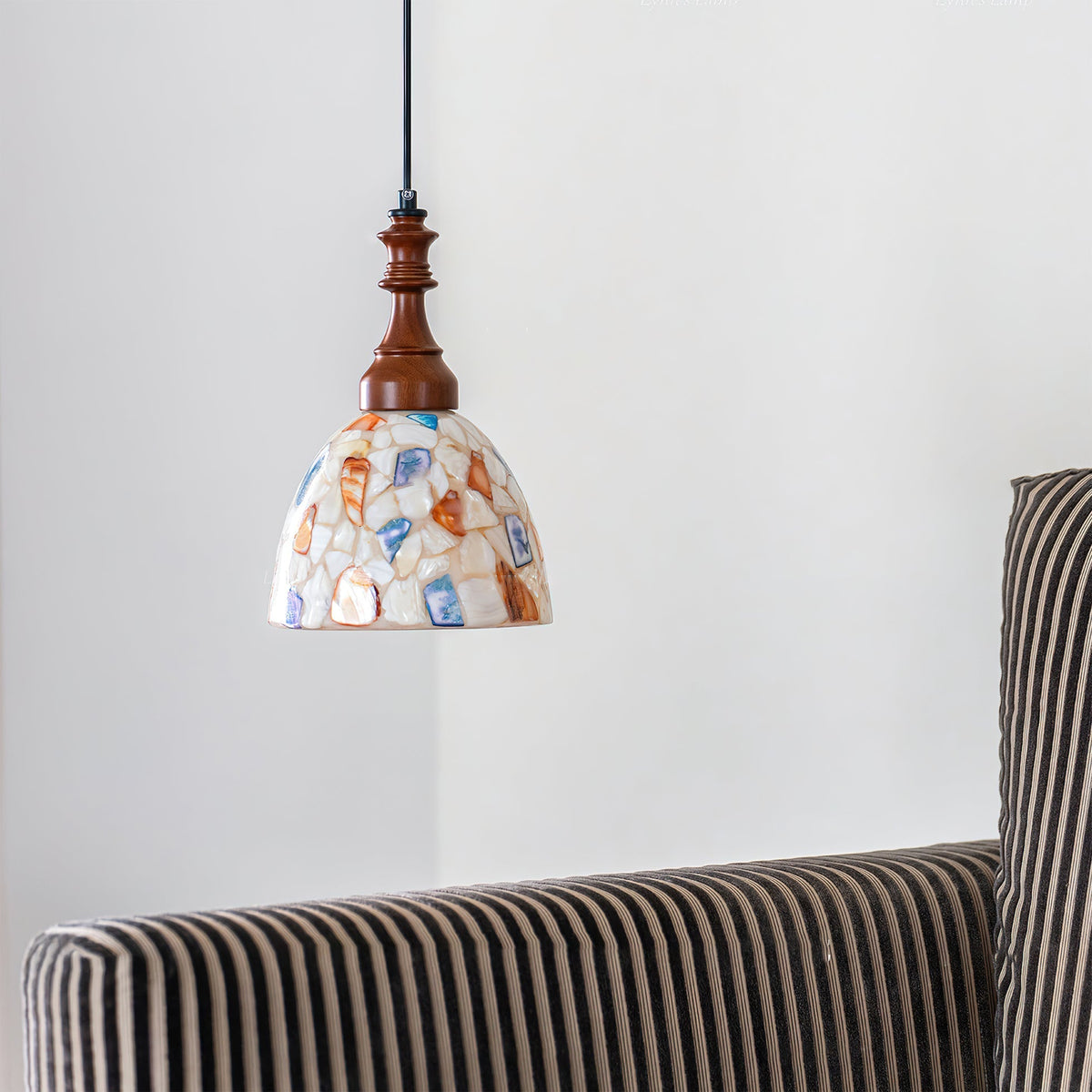 View of the ceiling mount and suspension wire for the Nonna Pendant Light.