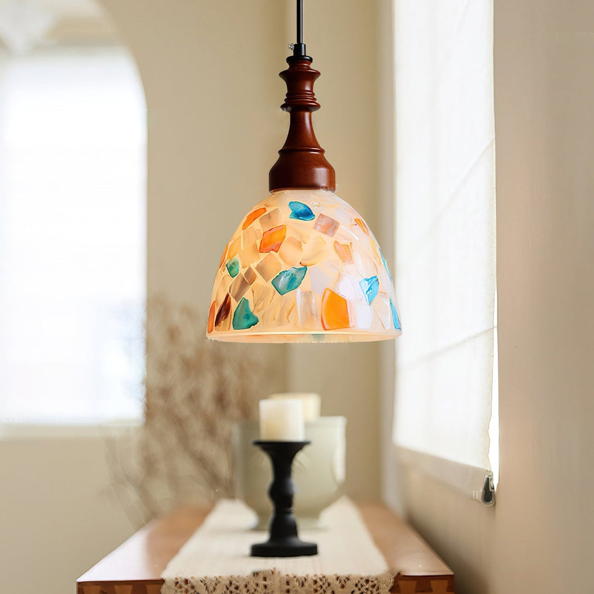 Close-up of the Nonna Pendant Light's glass shade and wooden top.