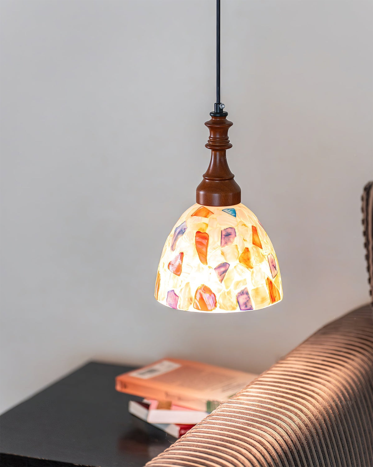 Detailed view of the metal and wood components of the pendant light.