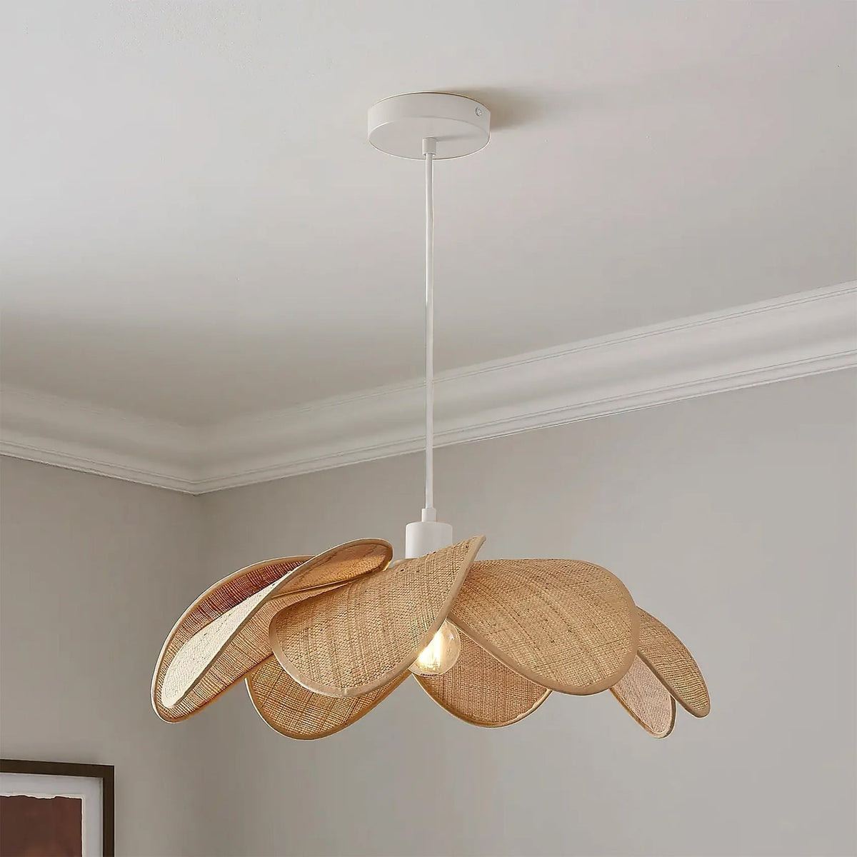 Close-up of the layered rattan petals on the Odilia Pendant Light.