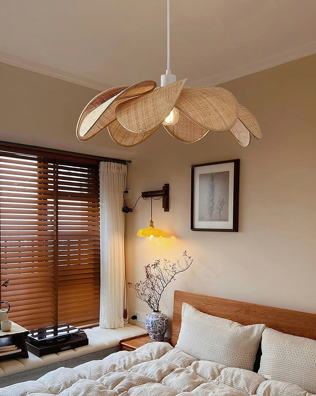 Detail view of the metal fixture and natural rattan shade.