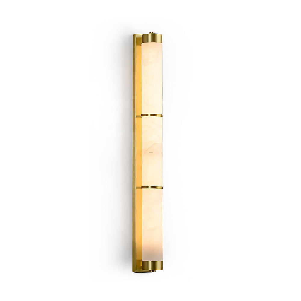 Olmirira Alabaster Wall Light in brass finish against a neutral wall.