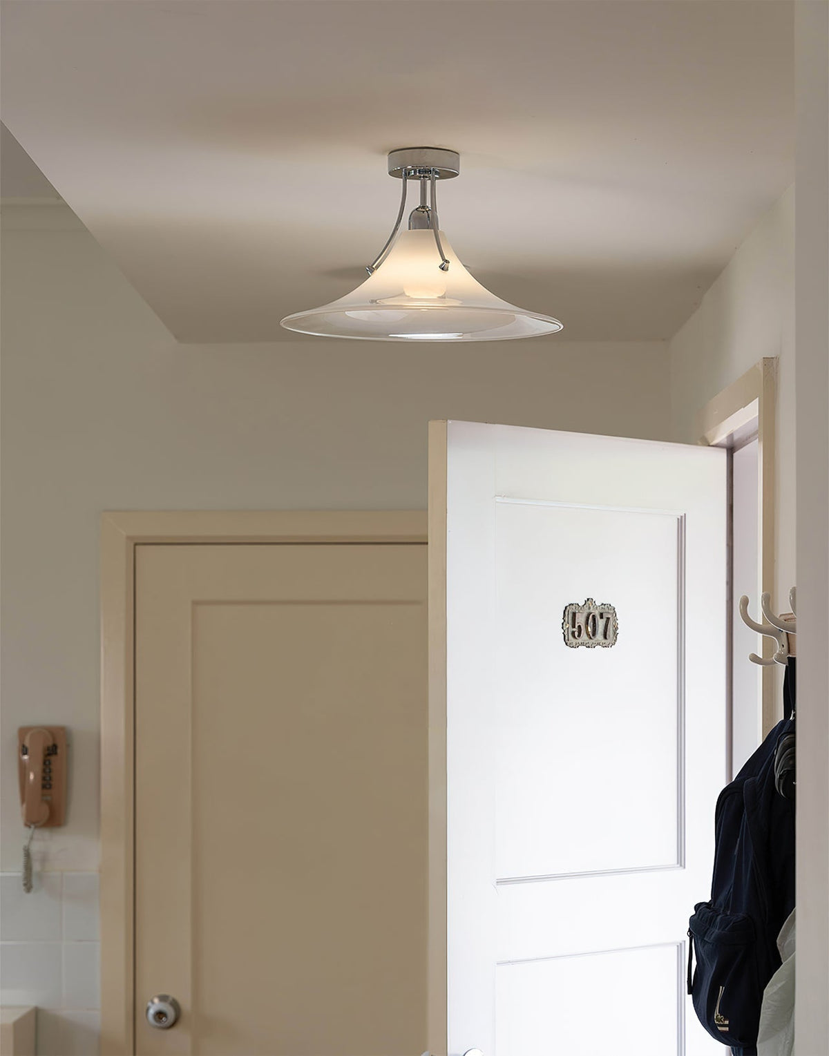 Angled view of the white and chrome Orient Ceiling Lamp.