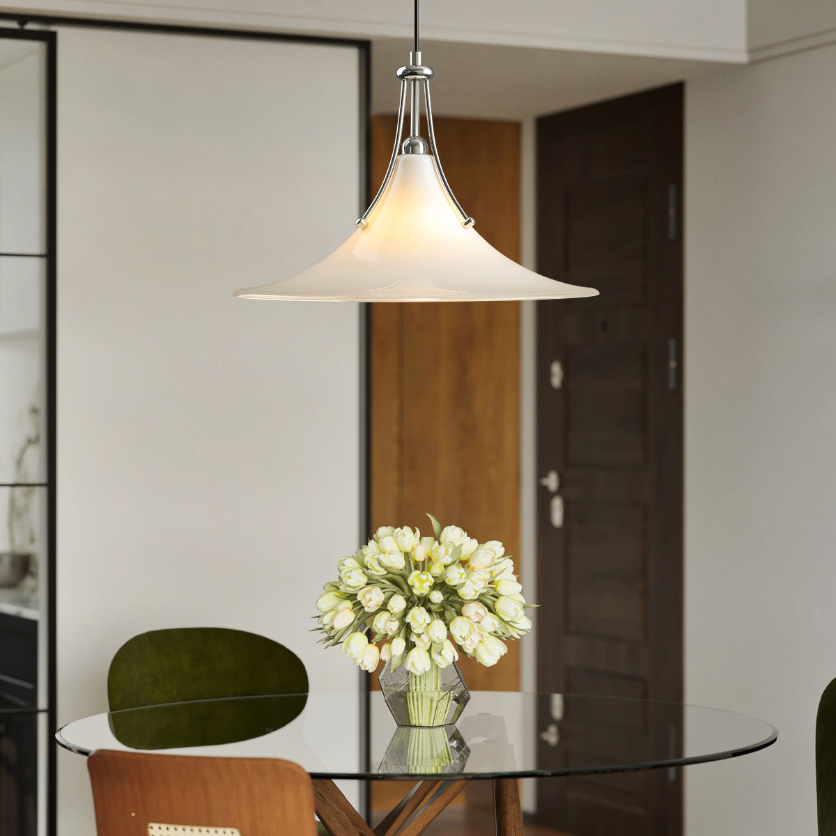 Close-up of the Orient Pendant Light's flared glass shade and chrome arm.