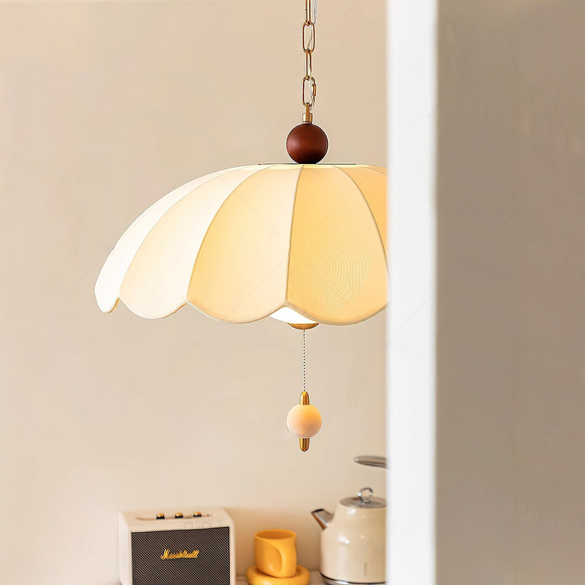 The Oriente Pendant Light hanging in a modern living room.