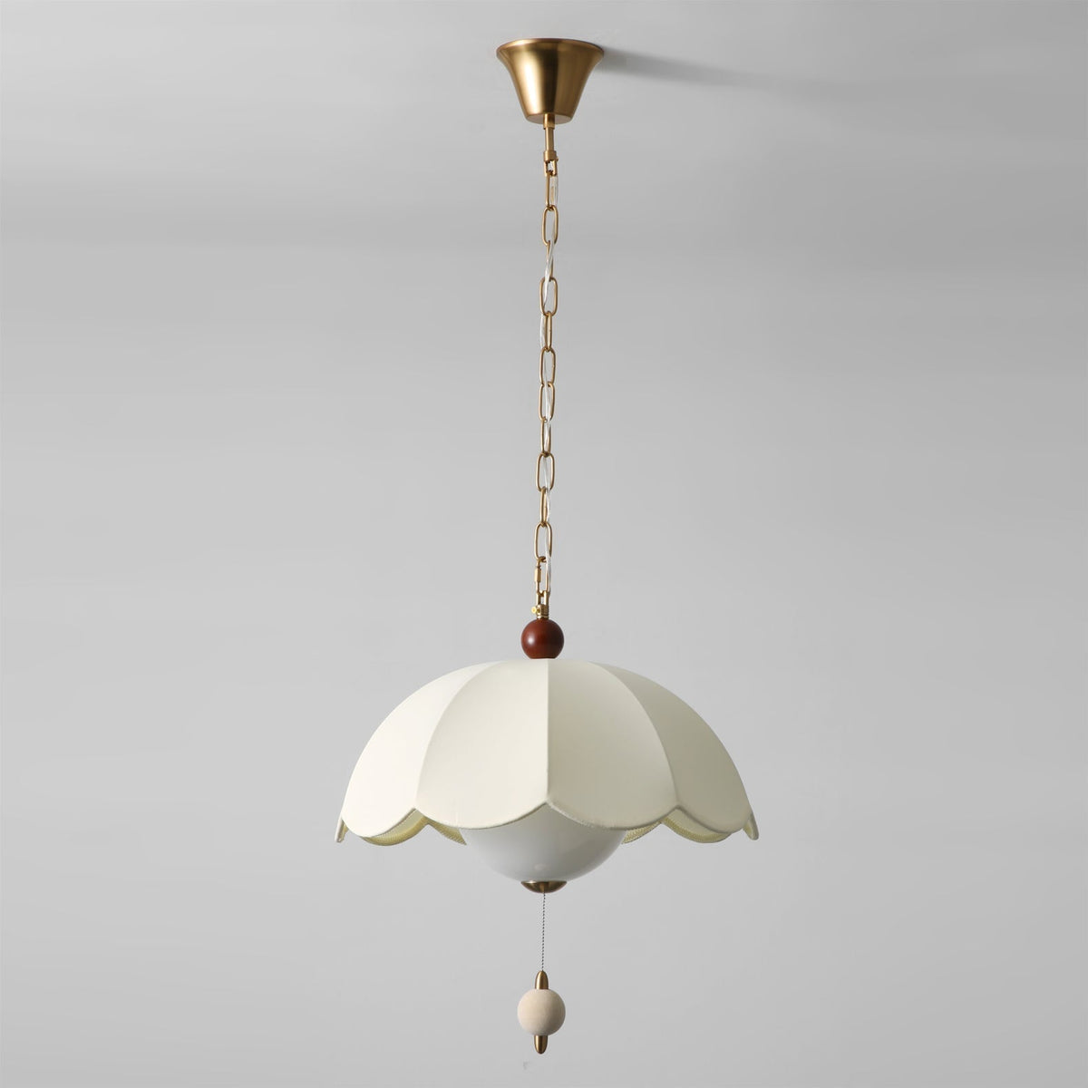 The Oriente Pendant Light as a central feature in a minimalist room.