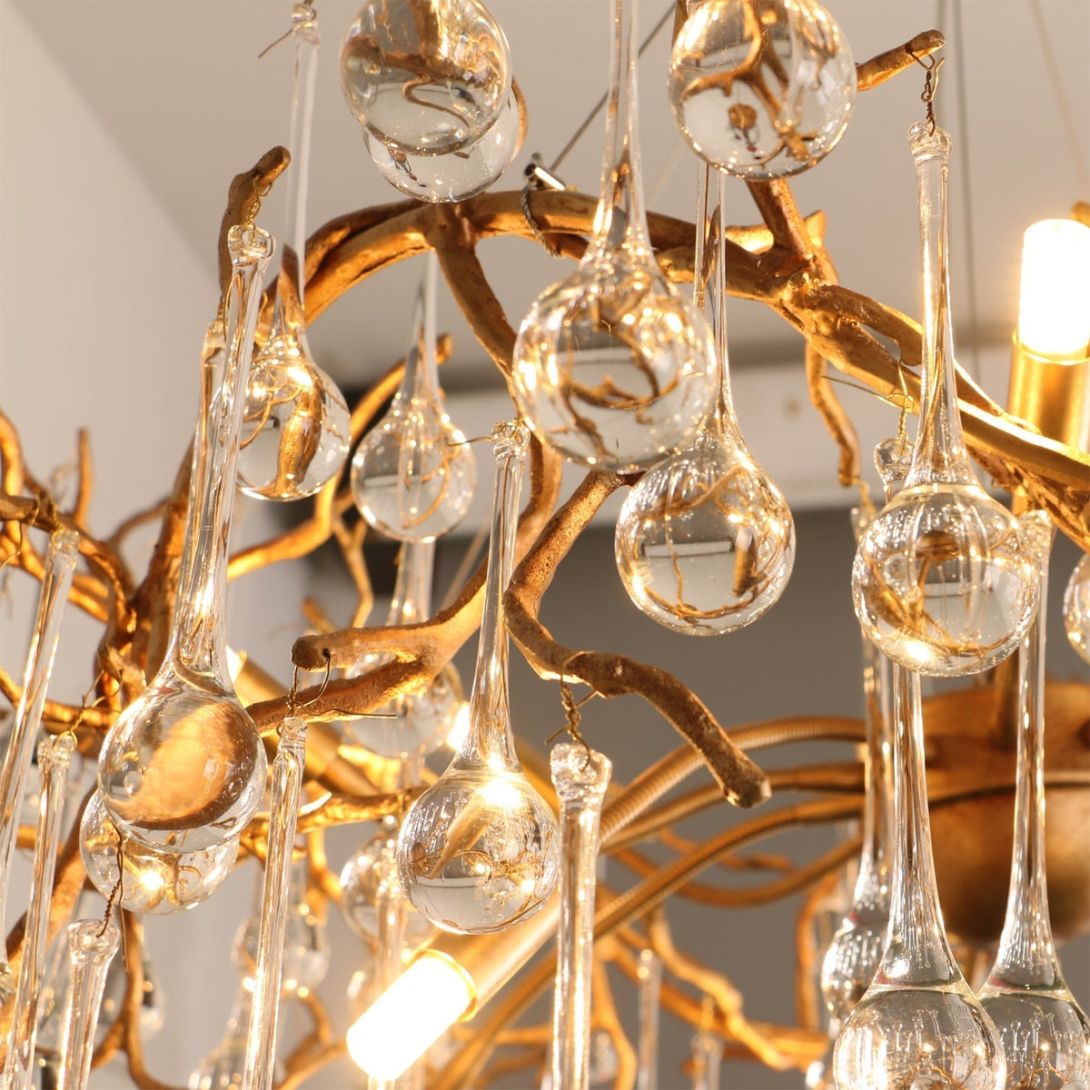 Detailed view of the intricate, hand-finished brass structure of the Palwa Chandelier.