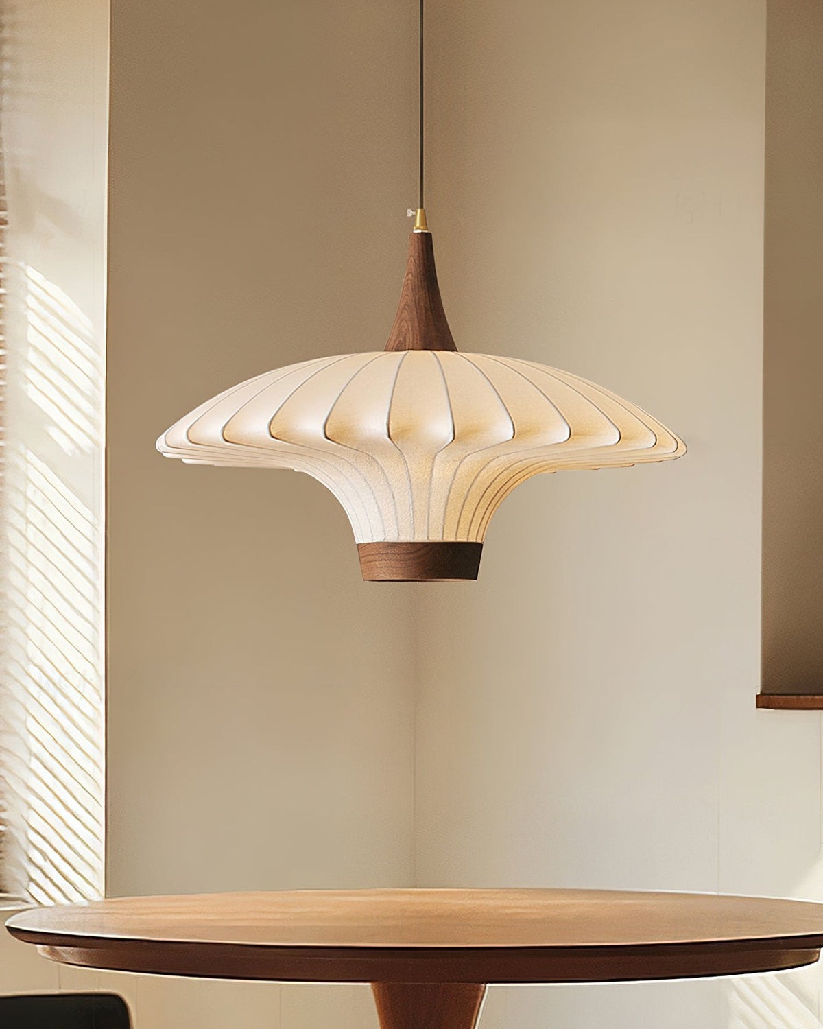 Parasol Pendant Light shown in a modern dining room setting.
