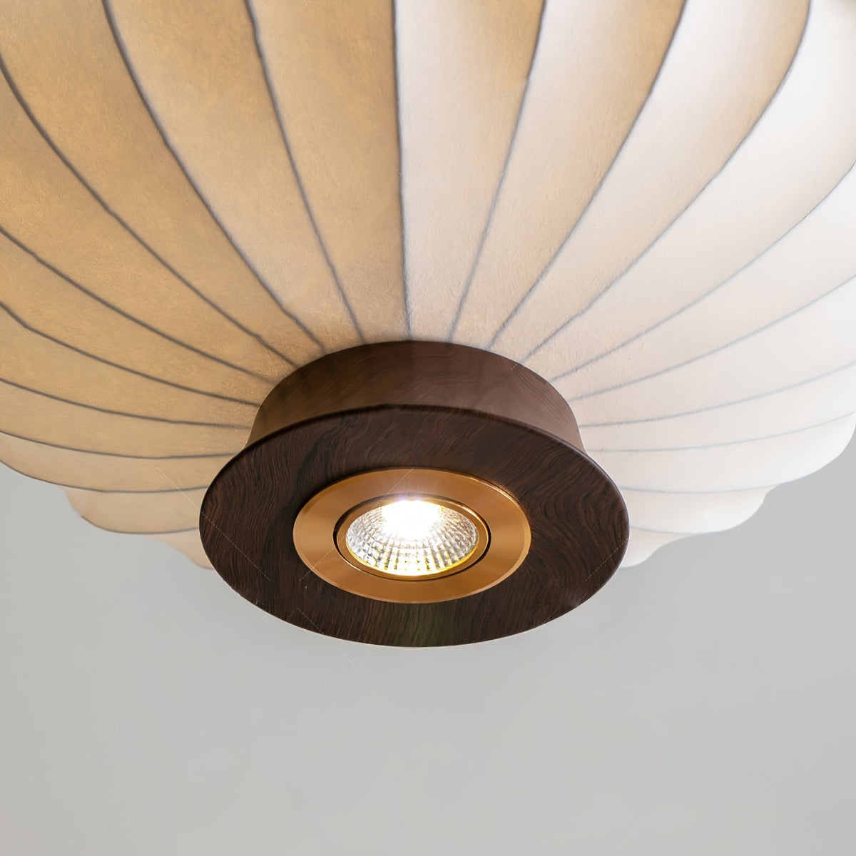 The Parasol Pendant Light illuminated, casting a warm, diffused glow.