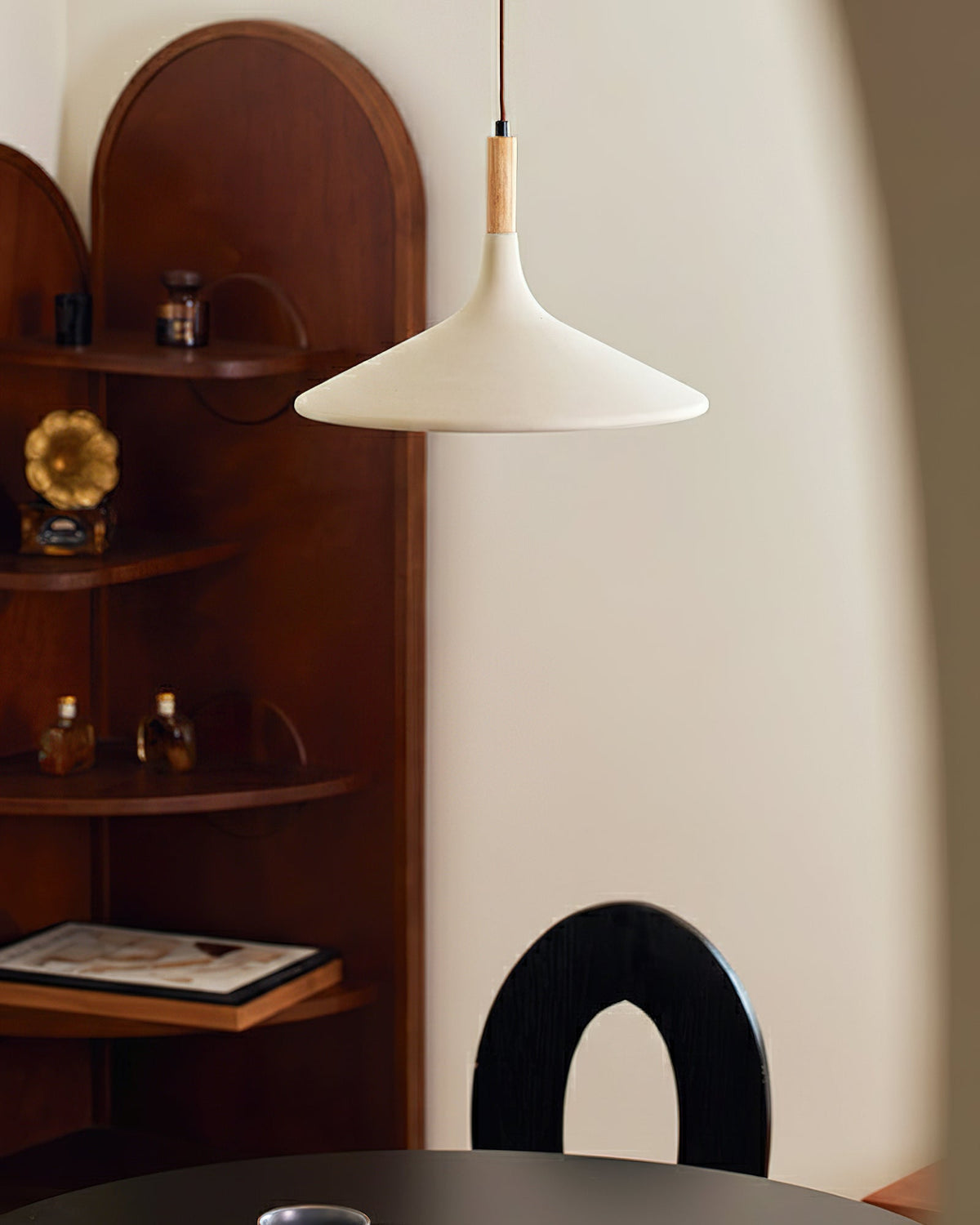 Side view of the Piero Pendant Lamp, highlighting its minimalist silhouette.