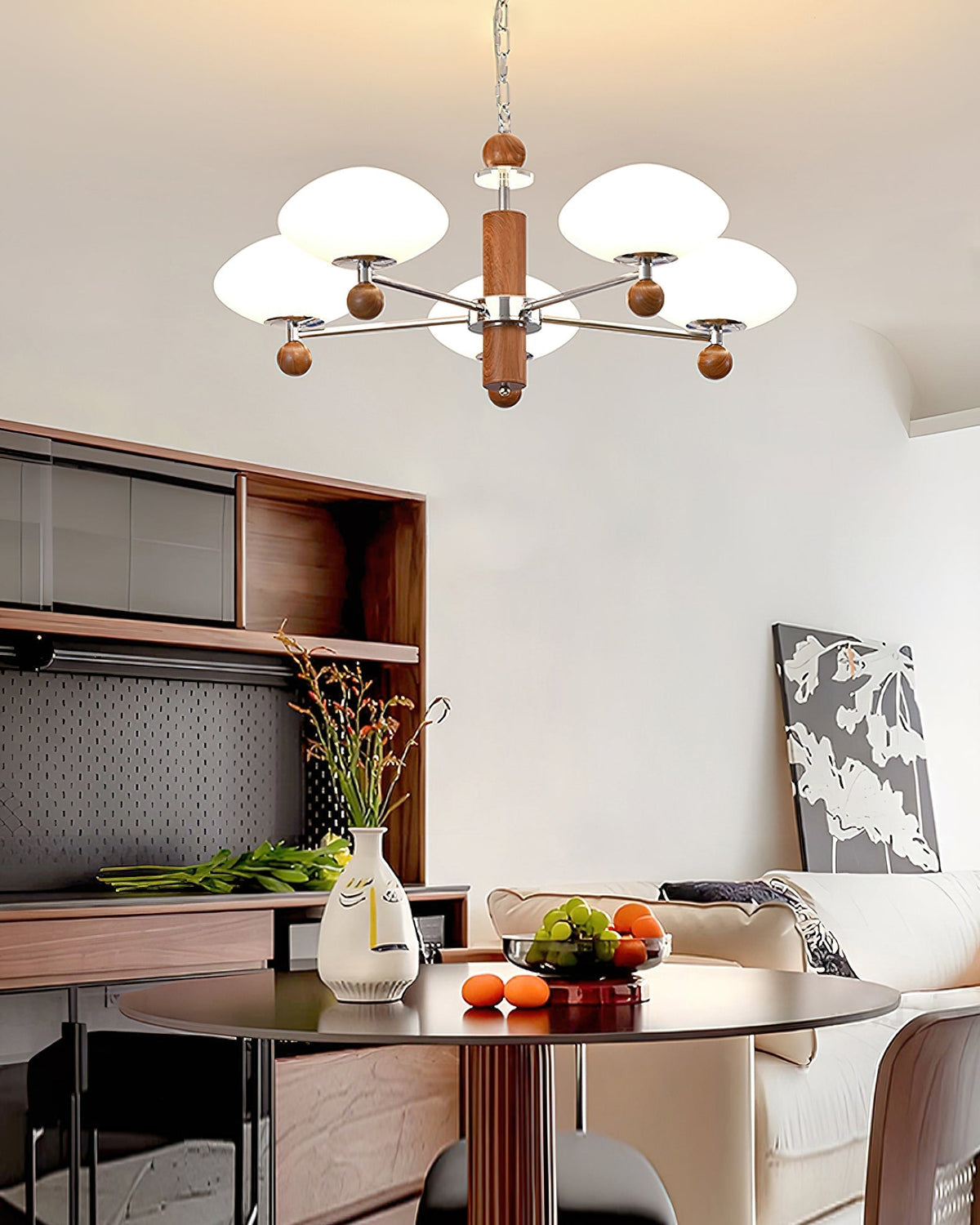 Close-up of a white glass shade and walnut accent on the Pointed Chandelier.