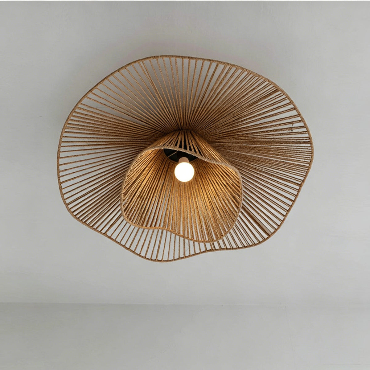 Side profile of the smaller Pontos Rattan Ceiling Light.