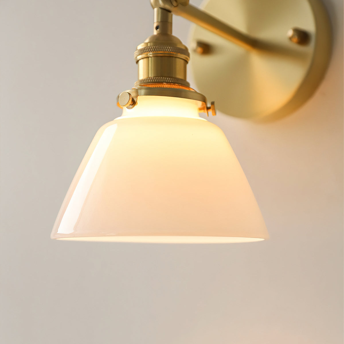 The sconce illuminated, casting a warm and inviting glow.