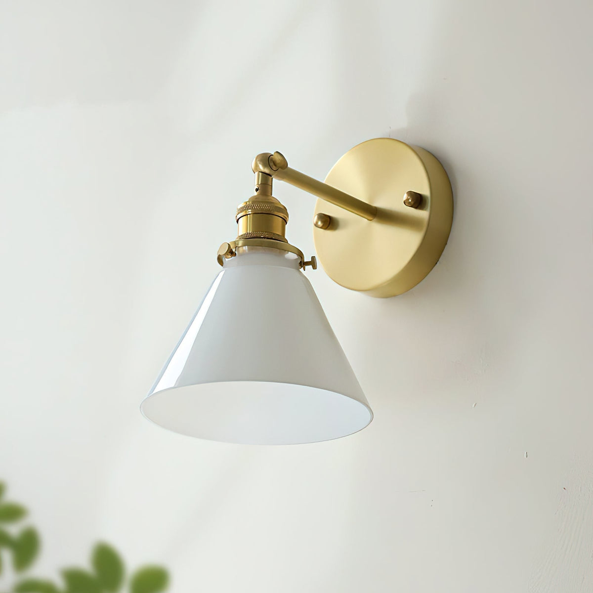Close-up of the brass swivel joint on the Portland Wall Sconce.