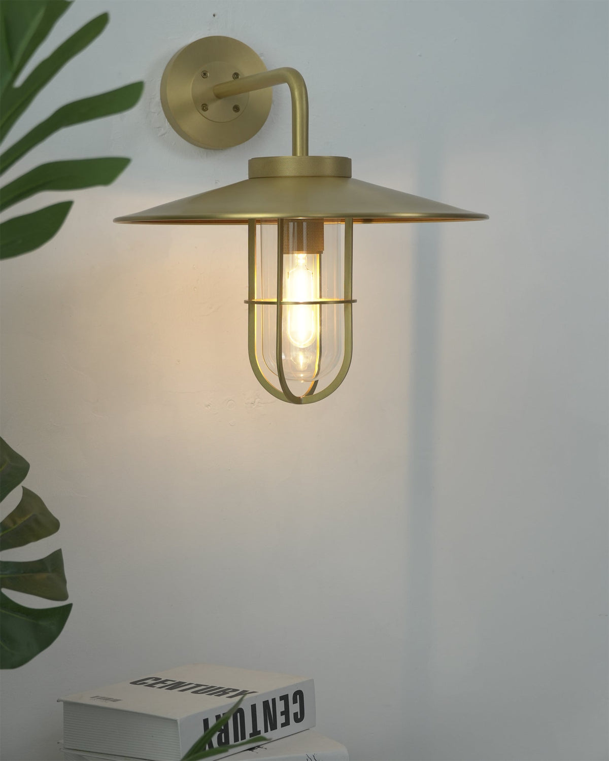 Portree Wall Light in brass finish from a low angle.