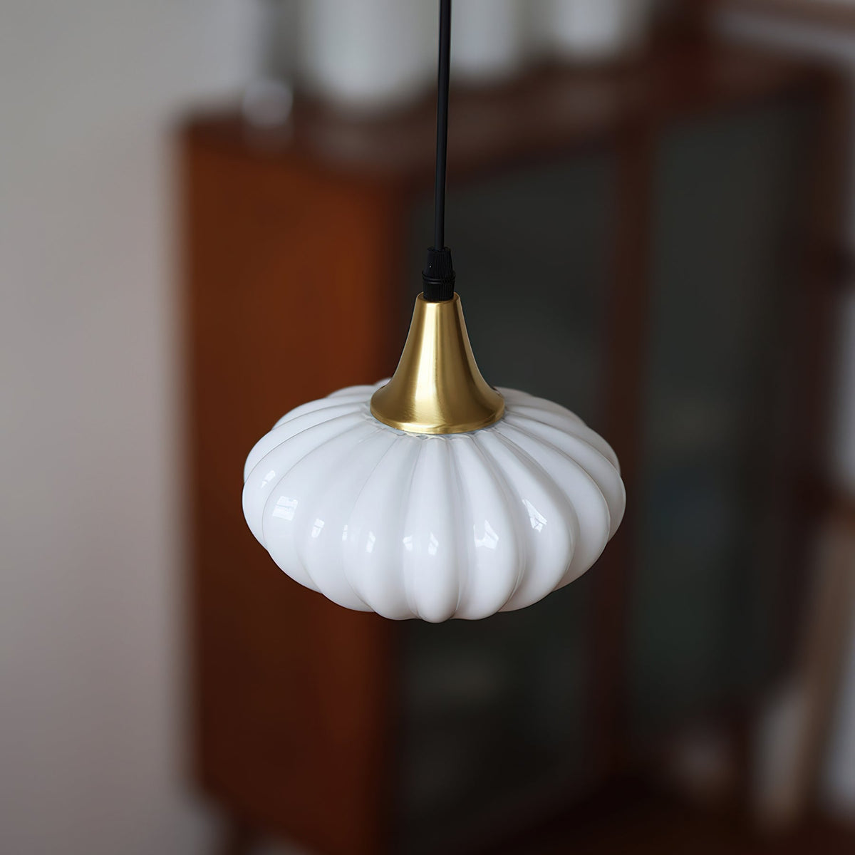 Angled view of the Model B pendant light, showcasing its taller, slender profile.