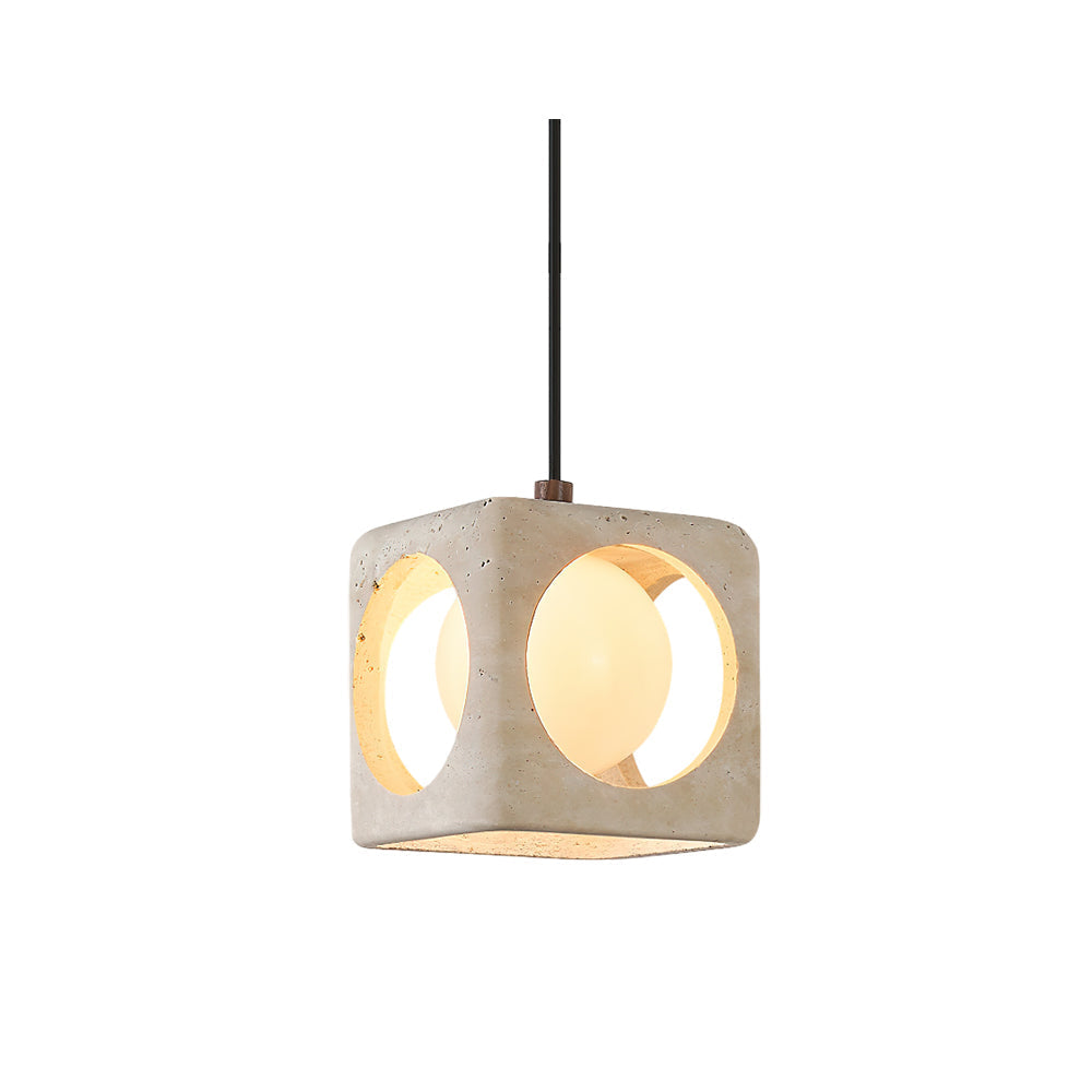 Remodern travertine pendant light shown against a neutral wall.