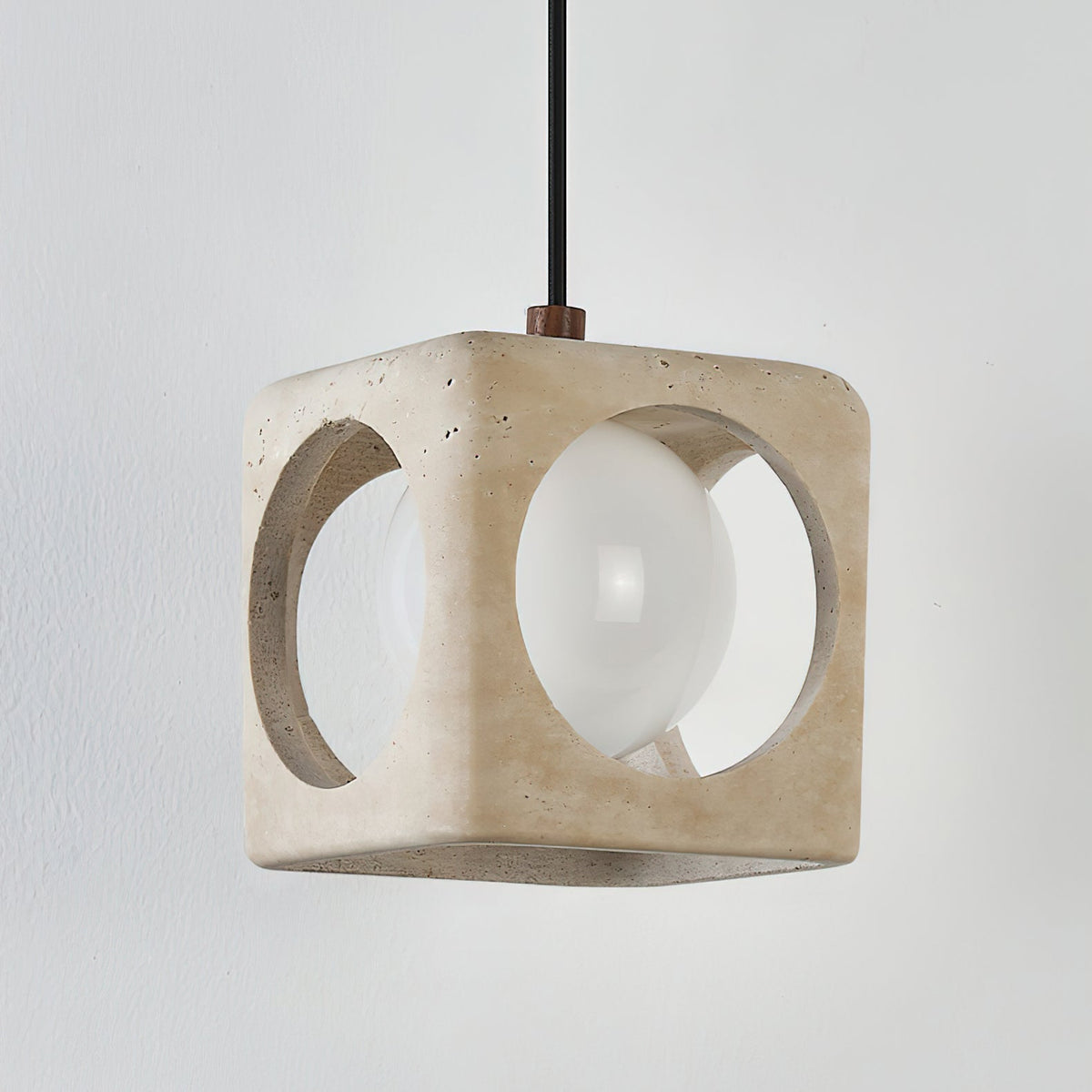 View of the pendant light in a minimalist living room setting.