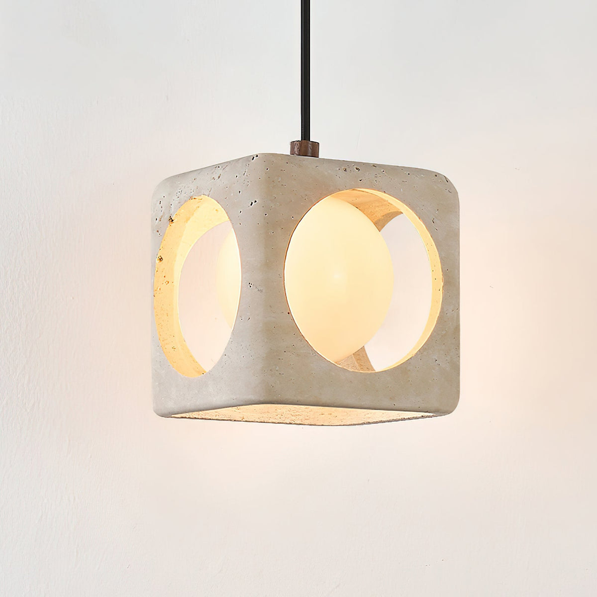 A cluster of three pendant lights hanging at different heights.