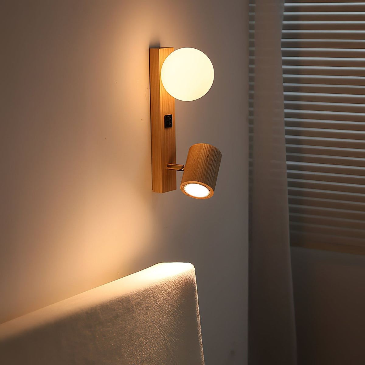 Angled view of the Rensen Wall Lamp showcasing its dual light sources.