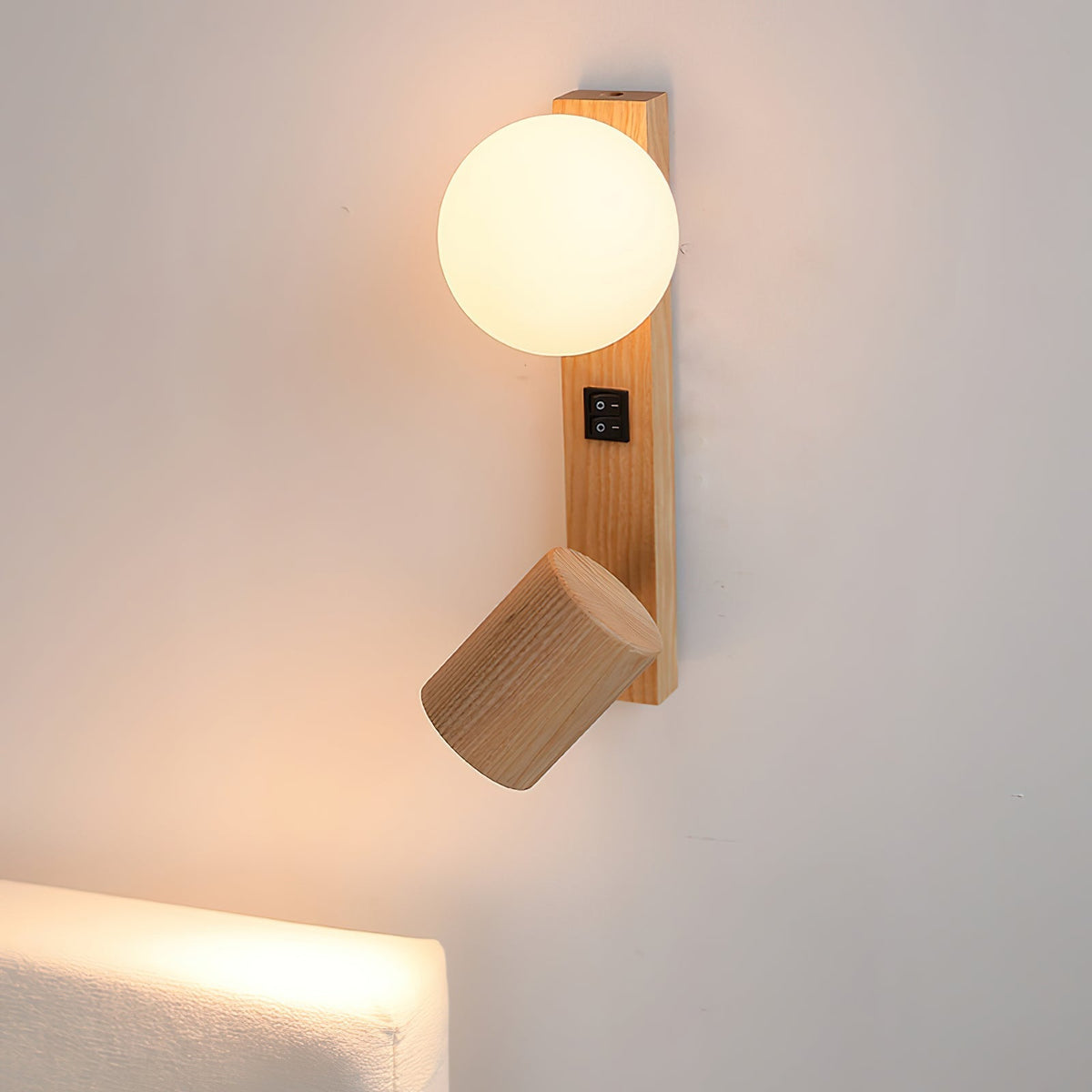 Detail shot of the adjustable cylindrical spotlight on the Rensen Wall Lamp.