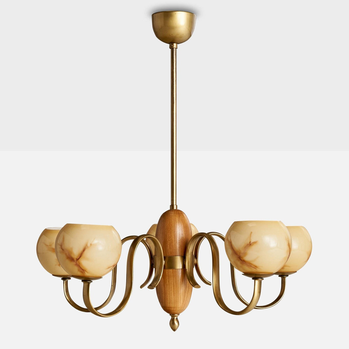 The 8-light linear Linnea Chandelier hanging over a kitchen island.