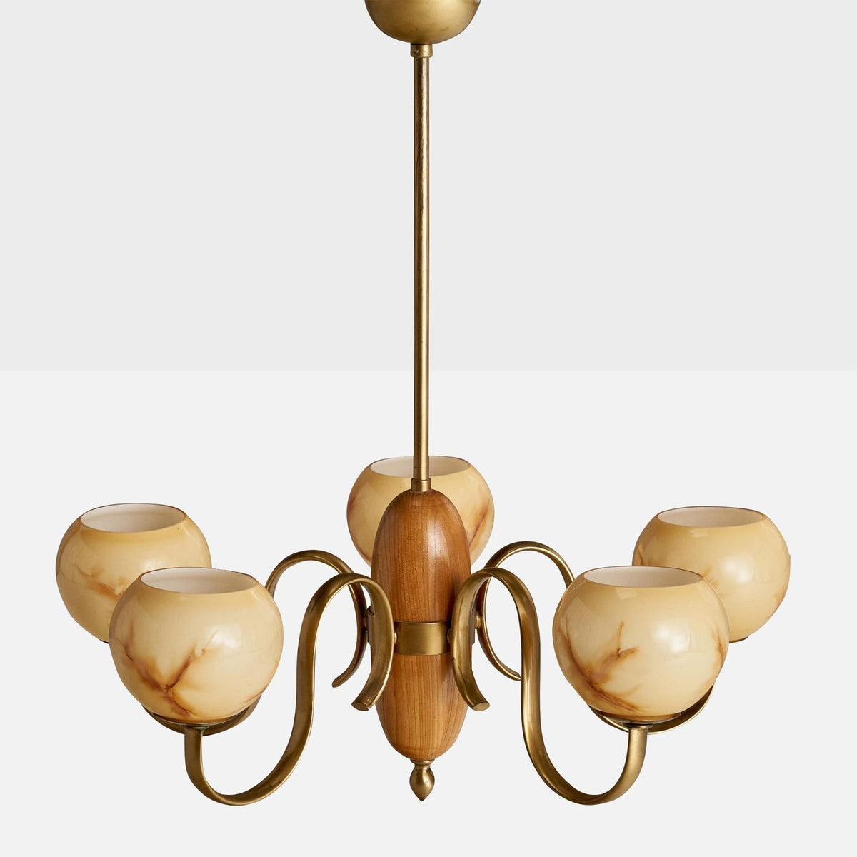Lifestyle image of the chandelier providing warm, diffused light in a living space.