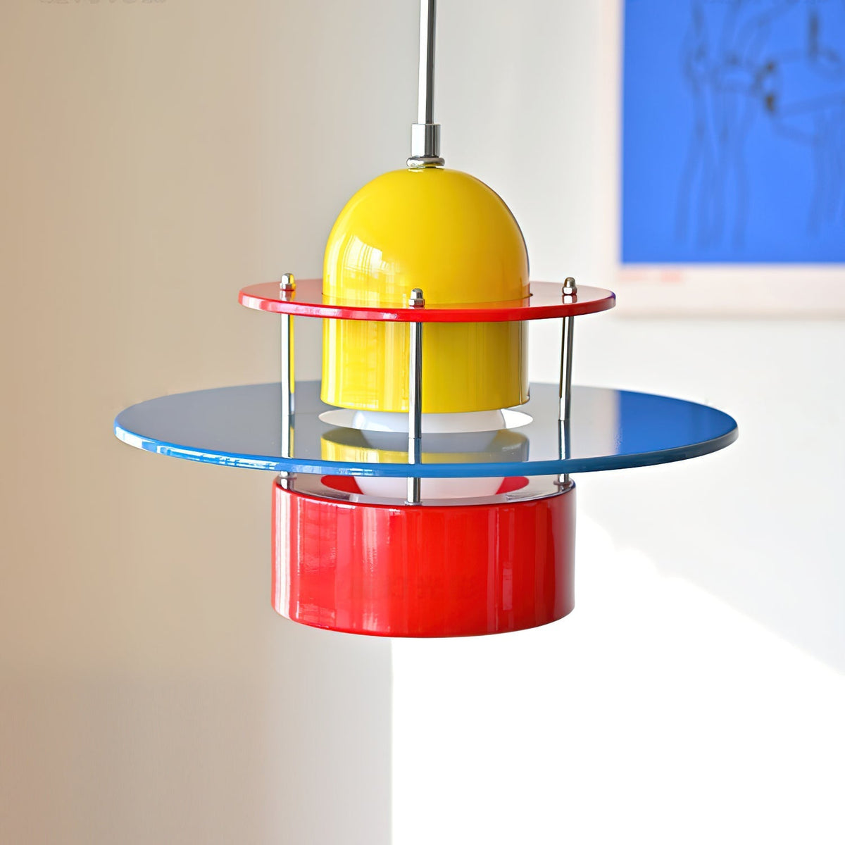 Close-up view of the Rolly Pendant Light's layered metal components.