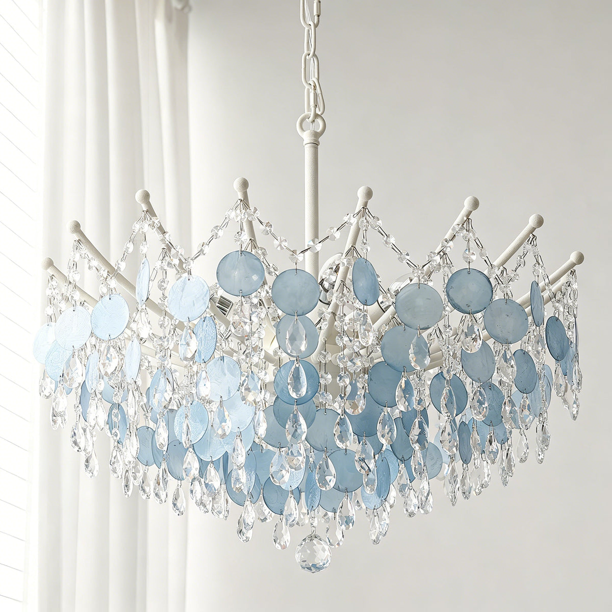 Close-up view of the tiered, natural capiz shells on the Sasha Chandelier.