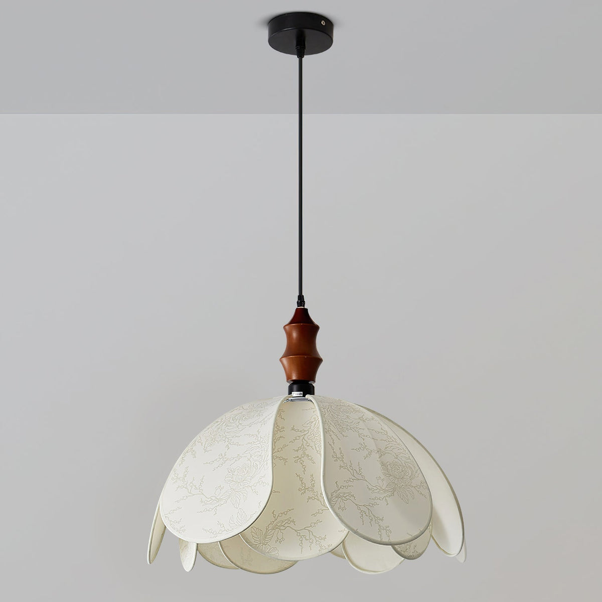 Detail shot of the walnut wood accent at the top of the pendant light.