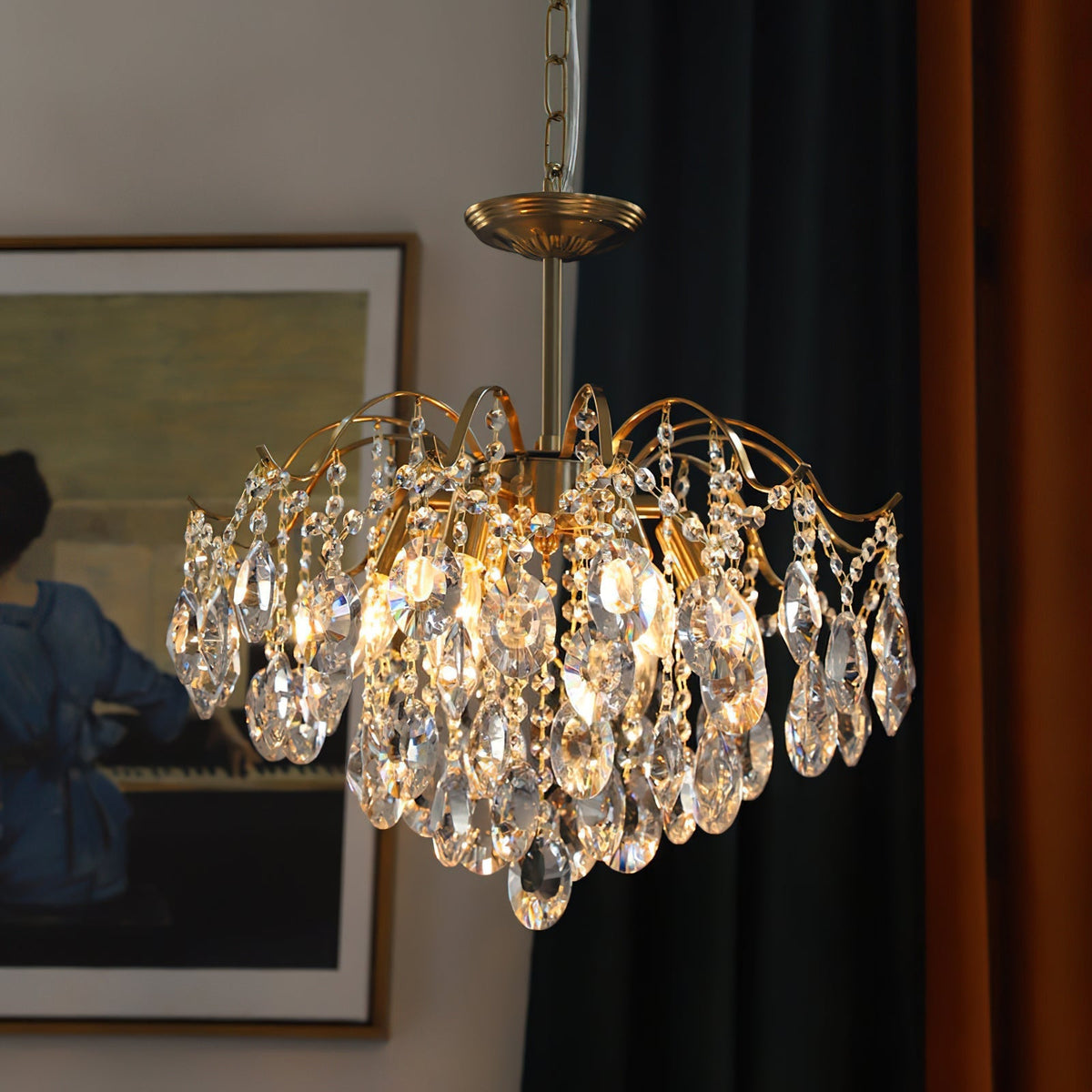 The chandelier shown with amber-tinted crystals for a warm glow.