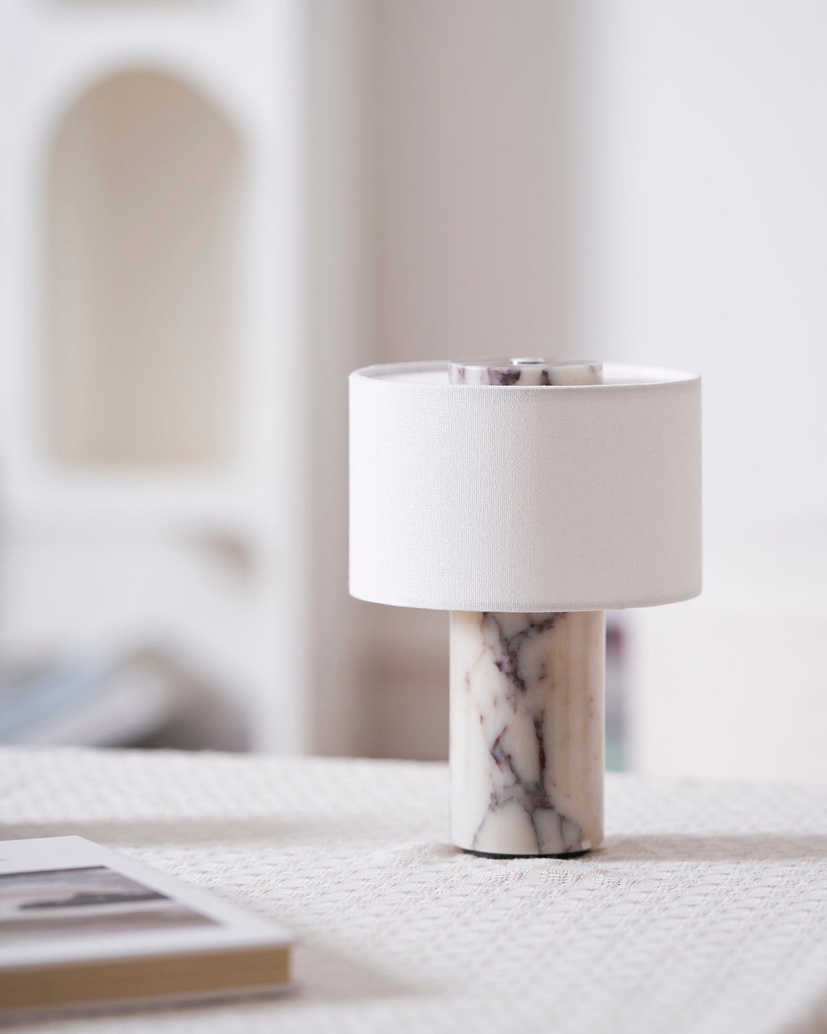 Angled view of the Sediment Table Lamp, highlighting its form.