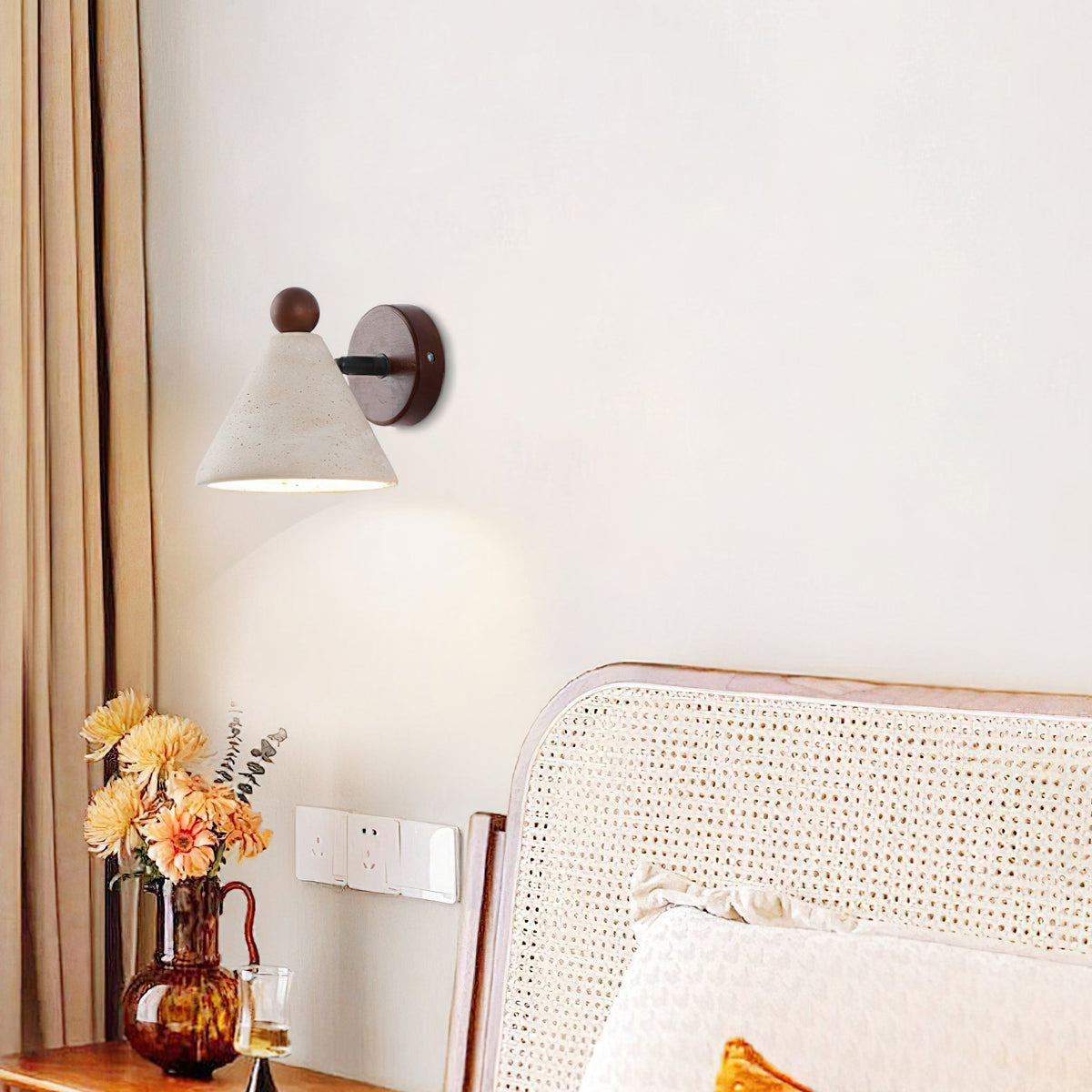A pair of Tiber Travertine Wall Lights installed as bedside reading lamps.