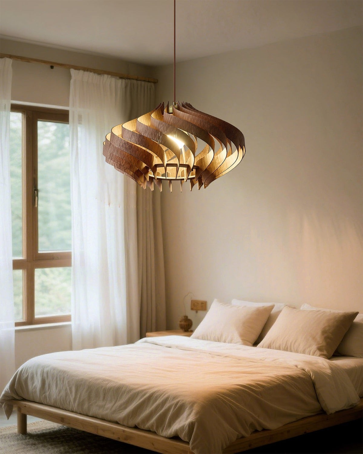 The Serentia Pendant Light providing ambient lighting in a creative studio space.