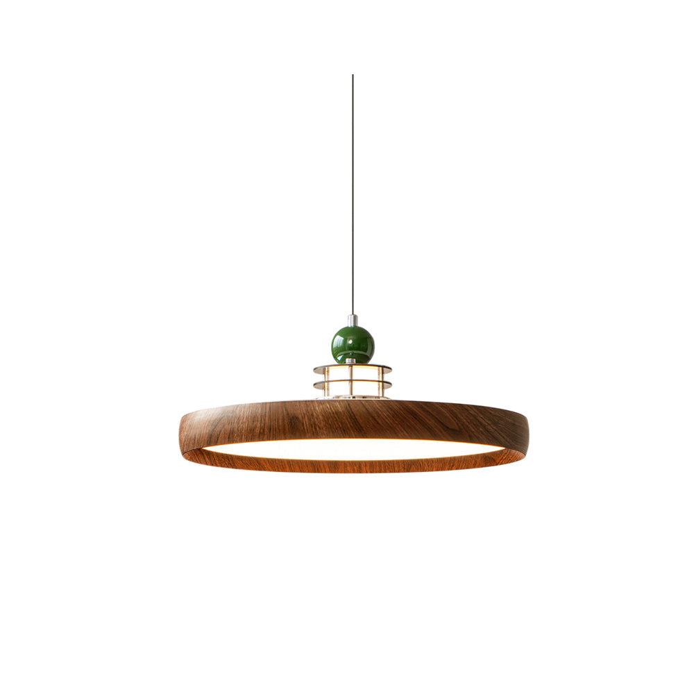 Sia Scalloped Saucer Pendant Light in walnut finish hanging in a dining room.