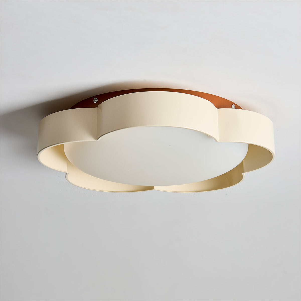 Close-up of the black metal accent on the walnut finish lamp.