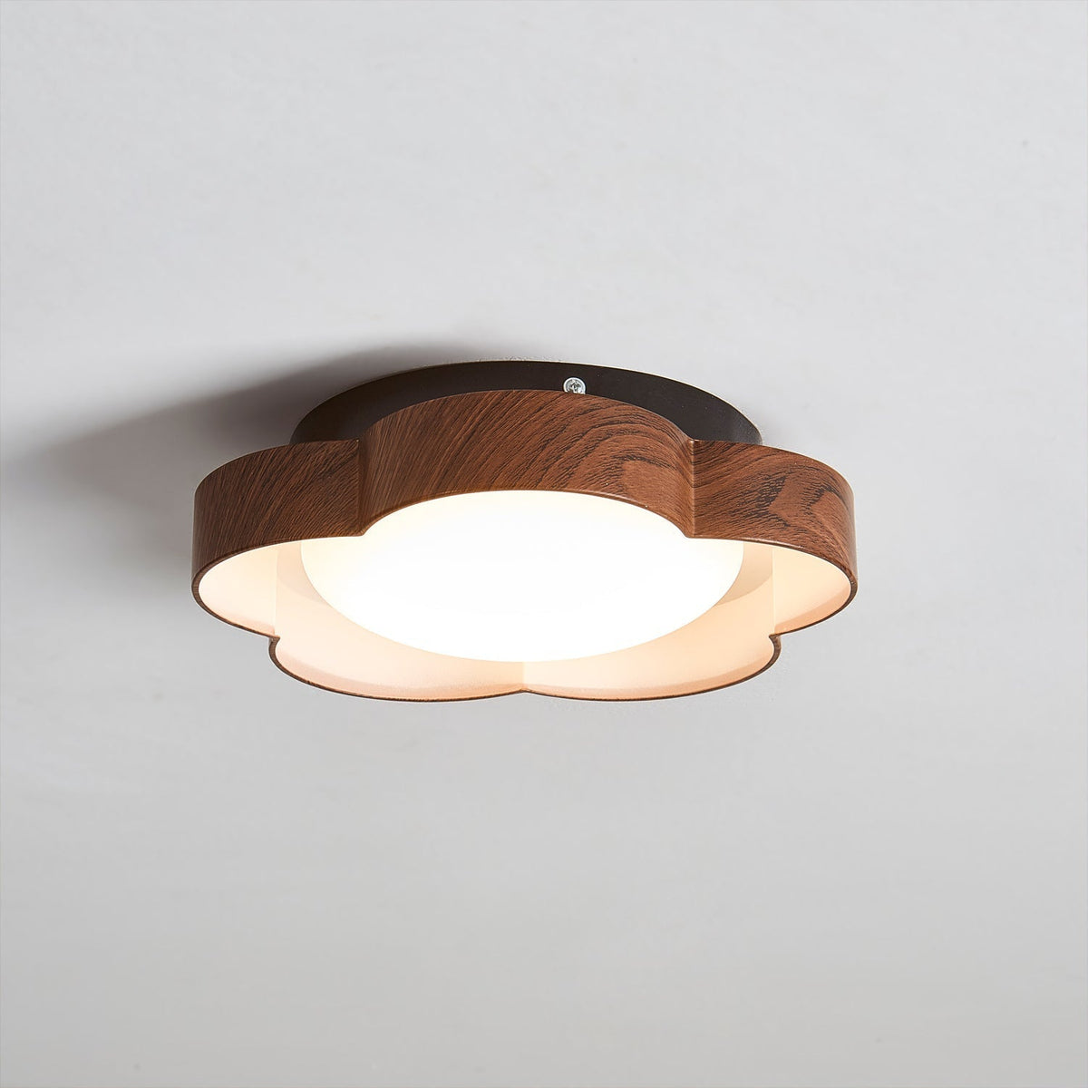 Angled shot of the large Sika Ceiling Lamp in Walnut & Black.