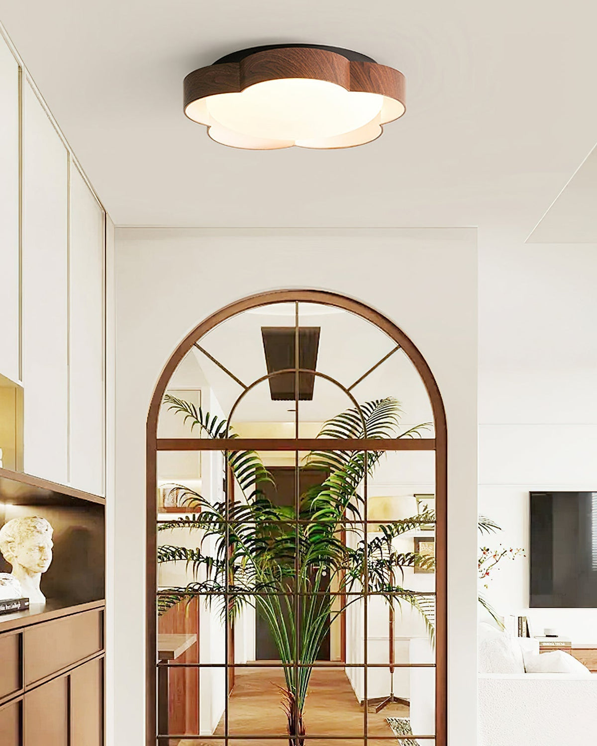 Sika Ceiling Lamp illuminating a modern living room.