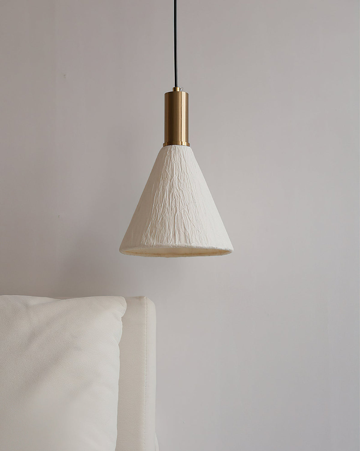 The pure white paper shade of the Siya Pendant Light, unlit.
