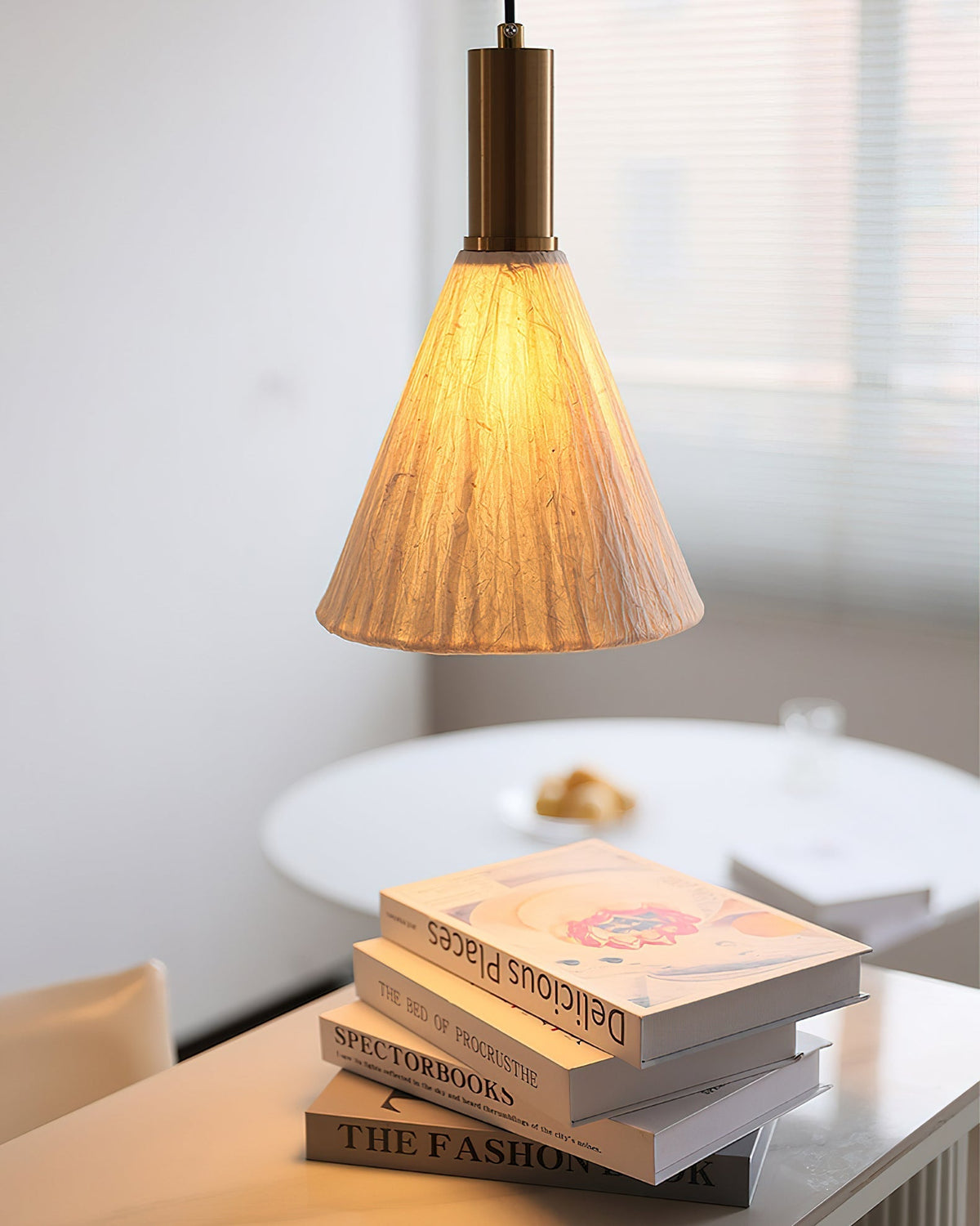 Angled view of the Siya Pendant Light highlighting its organic paper shade.