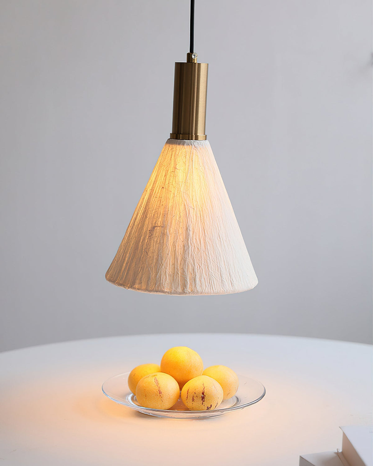 A cluster of Siya Pendant Lights hanging at different heights.
