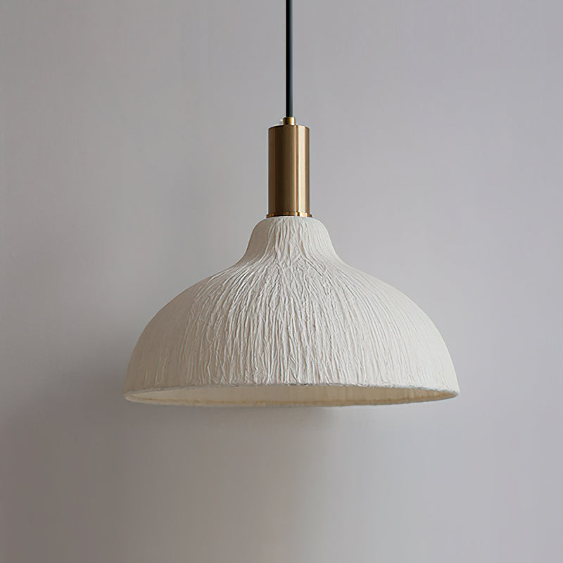 Siya Pendant Light with a visible Edison bulb inside for a vintage look.