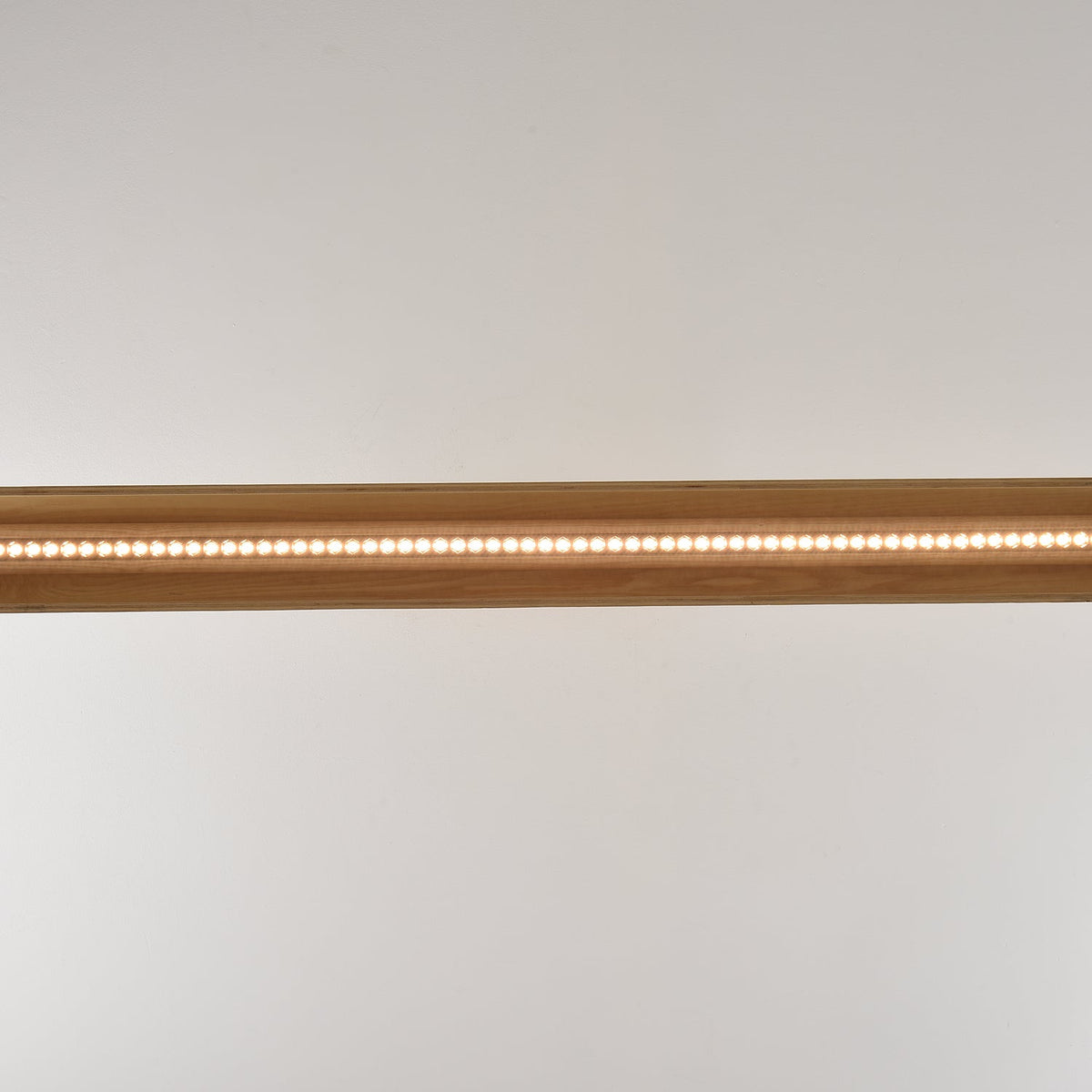 The 180cm version of the chandelier spanning a large table.