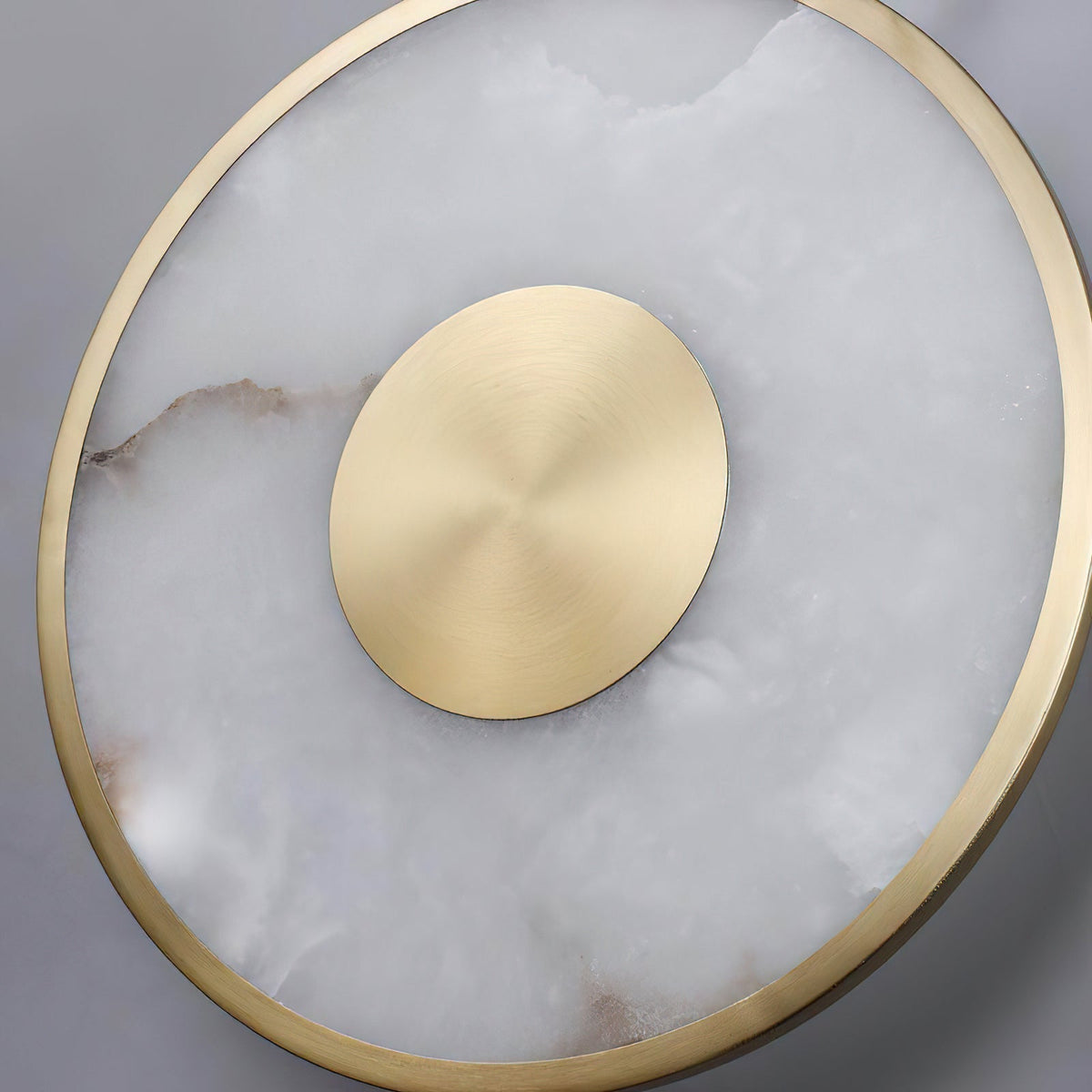 Lifestyle image showing the scale of the Sorle Alabaster Wall Lamp in a living space.
