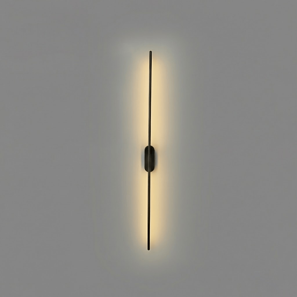 The black sconce mounted in a modern living room setting.