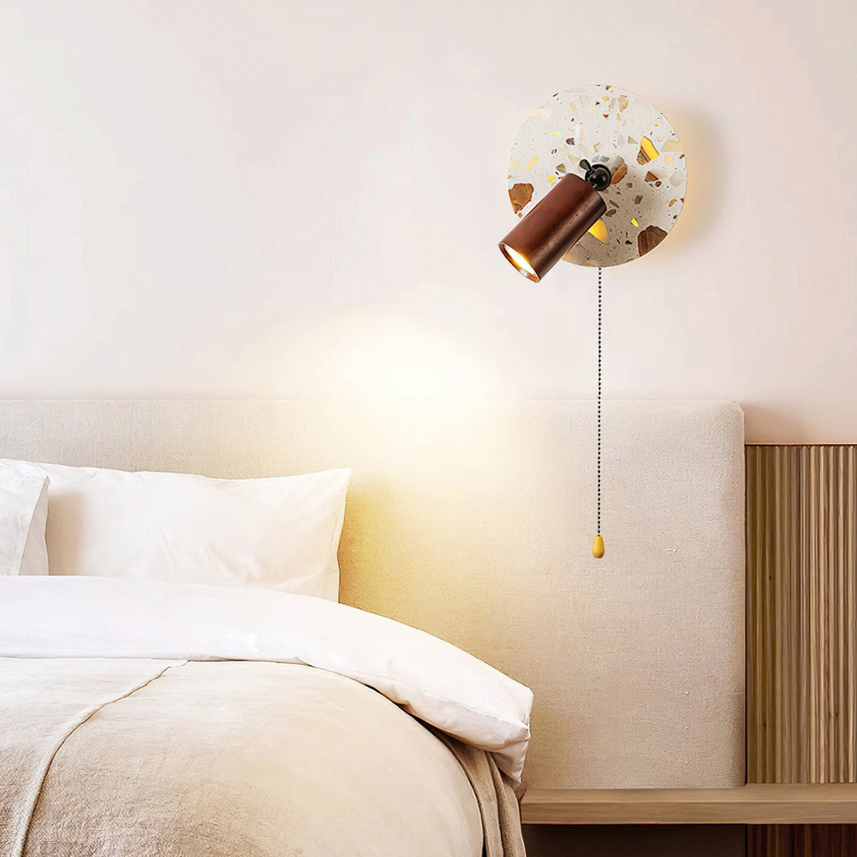 Swizzle Wall Lamp mounted on a wall in a living room setting.